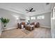 Spacious living room, featuring a sectional sofa and large windows at 14146 Cattle Egret Pl, Bradenton, FL 34202