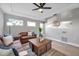 Light-filled living room featuring leather couches and a wood coffee table at 14146 Cattle Egret Pl, Bradenton, FL 34202
