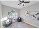 Bright home office with two armchairs and hardwood flooring at 14146 Cattle Egret Pl, Bradenton, FL 34202