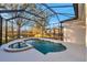 Large screened pool and spa with a covered lanai at 14146 Cattle Egret Pl, Bradenton, FL 34202