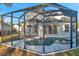 Inviting screened pool and spa with a large lanai at 14146 Cattle Egret Pl, Bradenton, FL 34202