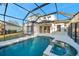 Inviting swimming pool and spa with a screened enclosure and backyard access at 14146 Cattle Egret Pl, Bradenton, FL 34202