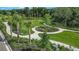 Expansive community park with walking paths and lush landscaping at 16606 San Nicola Pl, Lakewood Ranch, FL 34211
