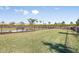 Fenced dog park with a bench for pet owners to relax at 16606 San Nicola Pl, Lakewood Ranch, FL 34211