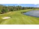 Aerial view of a beautiful golf course with sand traps and a pond at 16606 San Nicola Pl, Lakewood Ranch, FL 34211