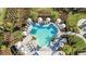 Relaxing community pool with plenty of lounge chairs and umbrellas at 16606 San Nicola Pl, Lakewood Ranch, FL 34211