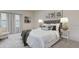 Well-lit bedroom with a plush bed and plenty of room at 17637 Cantarina Cv, Bradenton, FL 34211