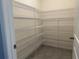 Spacious pantry with ample shelving for food storage at 17637 Cantarina Cv, Bradenton, FL 34211