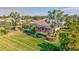 Lush backyard with pool and tropical landscaping at 210 166Th Ne St, Bradenton, FL 34212