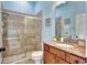 Clean bathroom with a large walk-in shower and granite vanity at 210 166Th Ne St, Bradenton, FL 34212
