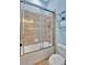 Bathroom with shower/tub combo and tile surround at 210 166Th Ne St, Bradenton, FL 34212
