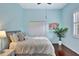 Bright bedroom with a comfortable bed and plenty of natural light at 210 166Th Ne St, Bradenton, FL 34212