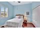 Charming bedroom with a wicker headboard and light blue walls at 210 166Th Ne St, Bradenton, FL 34212