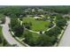 Expansive community park with open green space, playground, and walking paths at 210 166Th Ne St, Bradenton, FL 34212