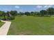 Open green space with a soccer goal and walking path at 210 166Th Ne St, Bradenton, FL 34212