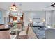 Bright dining area with a glass-top table and wicker chairs at 210 166Th Ne St, Bradenton, FL 34212
