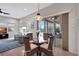 Dining area with wicker chairs, glass top table and view to pool at 210 166Th Ne St, Bradenton, FL 34212
