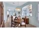 Elegant dining room with wood table and chairs at 210 166Th Ne St, Bradenton, FL 34212