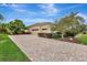 Brick paved driveway leading to garage at 210 166Th Ne St, Bradenton, FL 34212