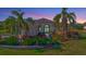 Luxury home with inviting landscaping and walkway at 210 166Th Ne St, Bradenton, FL 34212