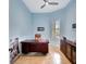 Bright home office with large desk and built-in shelving at 210 166Th Ne St, Bradenton, FL 34212