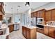 Modern kitchen featuring stainless steel appliances and a large island at 210 166Th Ne St, Bradenton, FL 34212