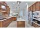 Modern kitchen with stainless steel appliances and granite countertops at 210 166Th Ne St, Bradenton, FL 34212