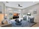 Relaxing living room with comfortable seating and a large TV at 210 166Th Ne St, Bradenton, FL 34212