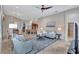 Open living space with gray sofas and view into kitchen and dining area at 210 166Th Ne St, Bradenton, FL 34212
