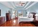 Bright main bedroom with pool access and hardwood floors at 210 166Th Ne St, Bradenton, FL 34212