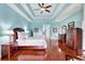 Spacious main bedroom with hardwood floors and ensuite bathroom at 210 166Th Ne St, Bradenton, FL 34212