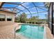 Enclosed pool with a water feature and patio at 210 166Th Ne St, Bradenton, FL 34212