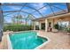 Resort-style screened pool with patio and seating at 210 166Th Ne St, Bradenton, FL 34212