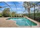 Enclosed pool area with water feature and patio at 210 166Th Ne St, Bradenton, FL 34212