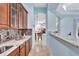 Wet bar with granite countertop, wooden cabinets, and a sink at 210 166Th Ne St, Bradenton, FL 34212