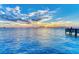 Peaceful pier view with sunset over calm water at 2944 Oriole Dr, Sarasota, FL 34243