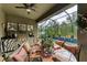 Outdoor kitchen and dining area overlooking the pool at 2944 Oriole Dr, Sarasota, FL 34243