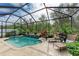 Enjoy this screened pool and patio with comfortable lounge chairs at 2944 Oriole Dr, Sarasota, FL 34243