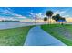 Curved waterfront path with palm trees and city views at 2944 Oriole Dr, Sarasota, FL 34243