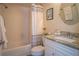 Bathroom with shower, toilet, and updated vanity at 3223 Beneva Rd # 201, Sarasota, FL 34232