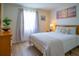 Well-lit bedroom with a queen-size bed and nightstands at 3223 Beneva Rd # 201, Sarasota, FL 34232