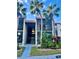 Two-story building with Spanish tile roofs and lush landscaping at 3223 Beneva Rd # 201, Sarasota, FL 34232