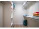Large walk-in closet with shelving and hanging rods at 3223 Beneva Rd # 201, Sarasota, FL 34232