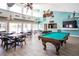 Community room with a pool table and seating area at 3223 Beneva Rd # 201, Sarasota, FL 34232