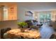 Dining area with glass-top table and view into living room at 3223 Beneva Rd # 201, Sarasota, FL 34232
