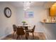 Cozy dining area with glass table and four chairs at 3223 Beneva Rd # 201, Sarasota, FL 34232