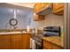 Kitchen features wood cabinets, granite countertops and stainless steel appliances at 3223 Beneva Rd # 201, Sarasota, FL 34232