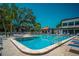 Inviting swimming pool with plenty of lounge chairs at 3223 Beneva Rd # 201, Sarasota, FL 34232