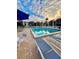 Relaxing pool area with lounge chairs and patio furniture at 3223 Beneva Rd # 201, Sarasota, FL 34232