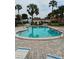 Community pool with plenty of lounge chairs at 3314 Mcdill Rd # 3314, Bradenton, FL 34207